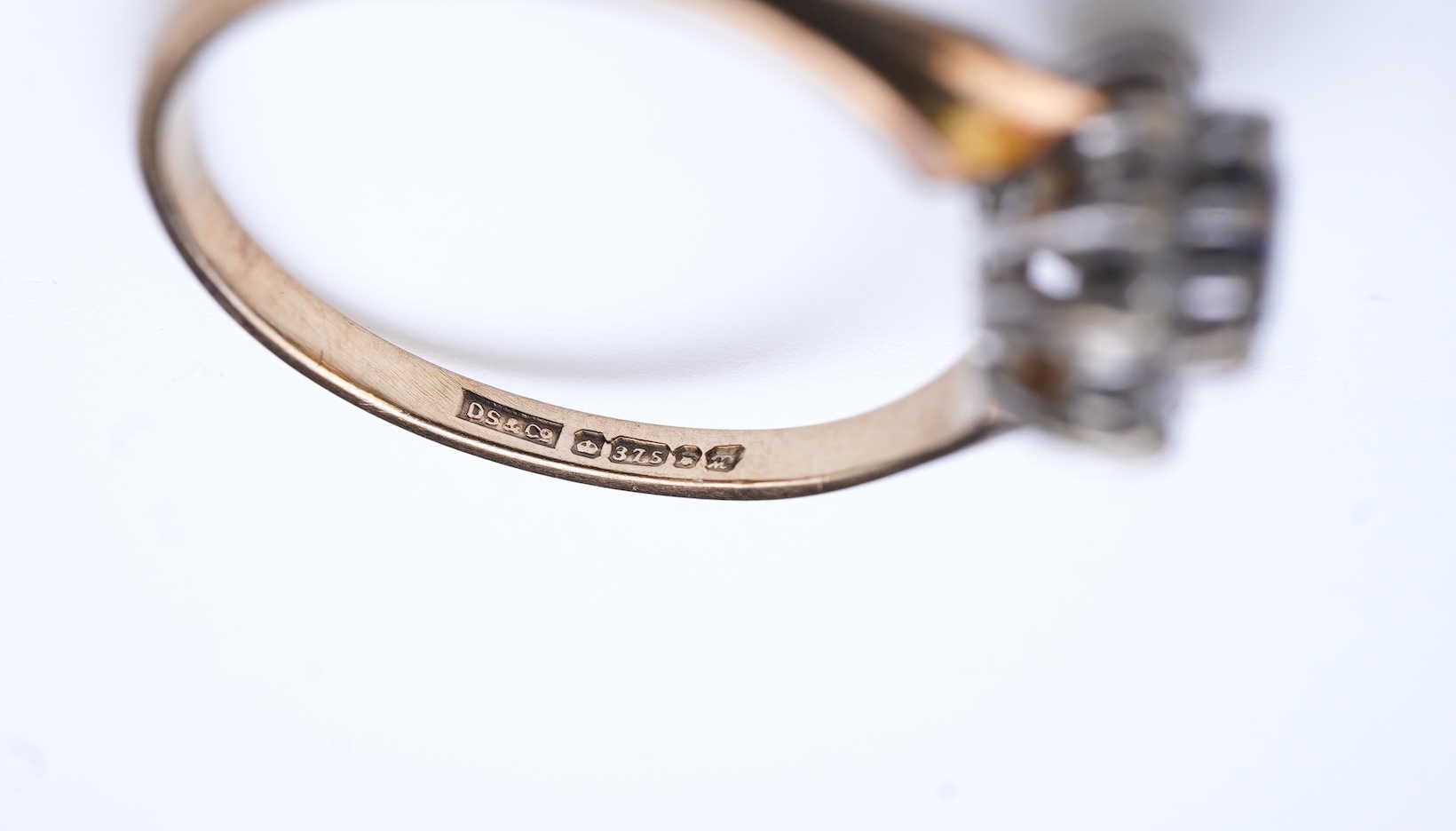 A group of three rings and a tie pin